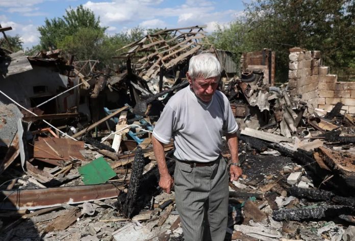 99843575-a-local-resident-79-reacts-next-to-his-house-destroyed-by-alleged-russian-shelling-in-bakhm